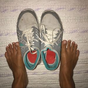 Very worn tennis shoes sneakers