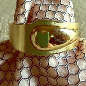 Hinged bracelet signed