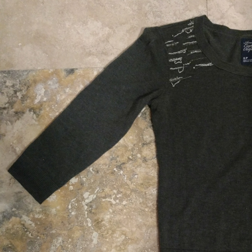 Hunter green sweater with shoulder detail