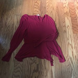 Flowy red long sleeve top with bottom accents
