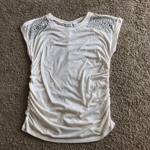 Cream top w/ jeweler shoulders, roushed side/back