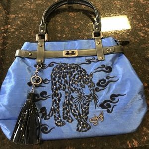 Royal blue purse with navy accents.