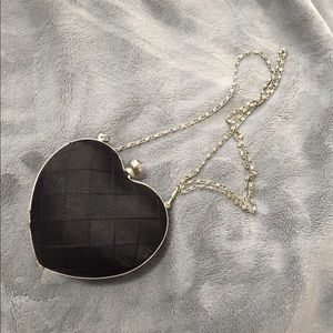 Black quilted heart clutch
