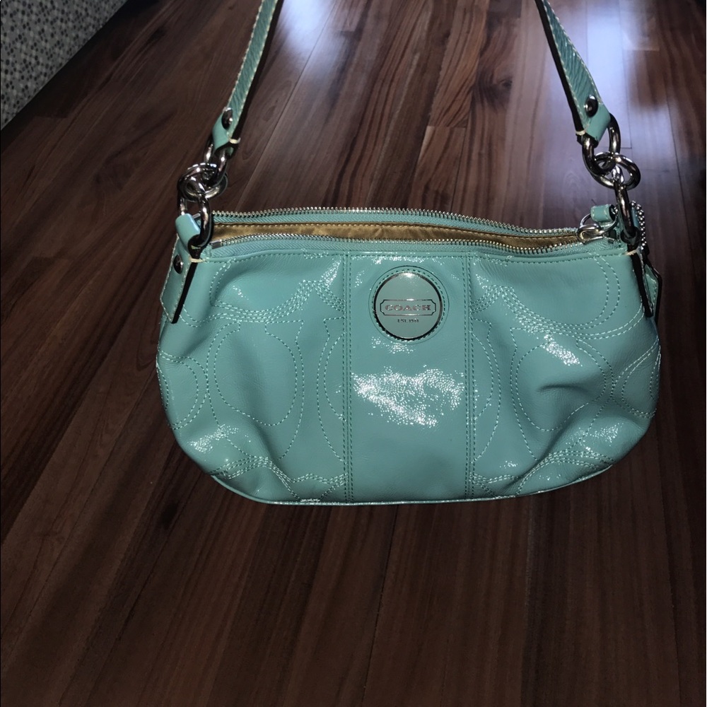 Real coach purse never used, light blue.