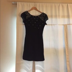 Wish boutique black dress with pearls and studs.