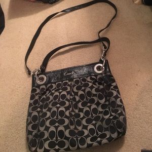 Gray and black coach purse