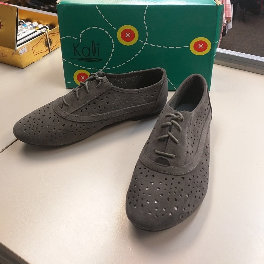 Gray oxfords with geometric cut shapes