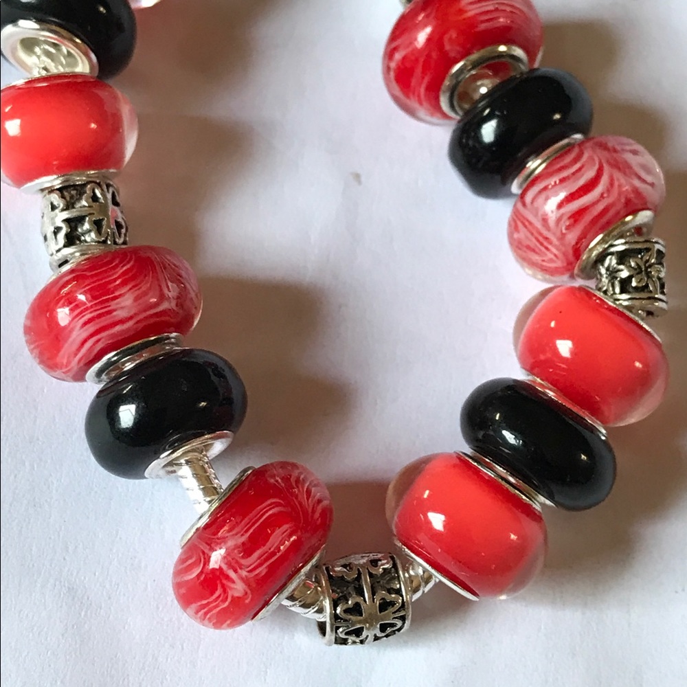 Silver bracelet with red and black beads