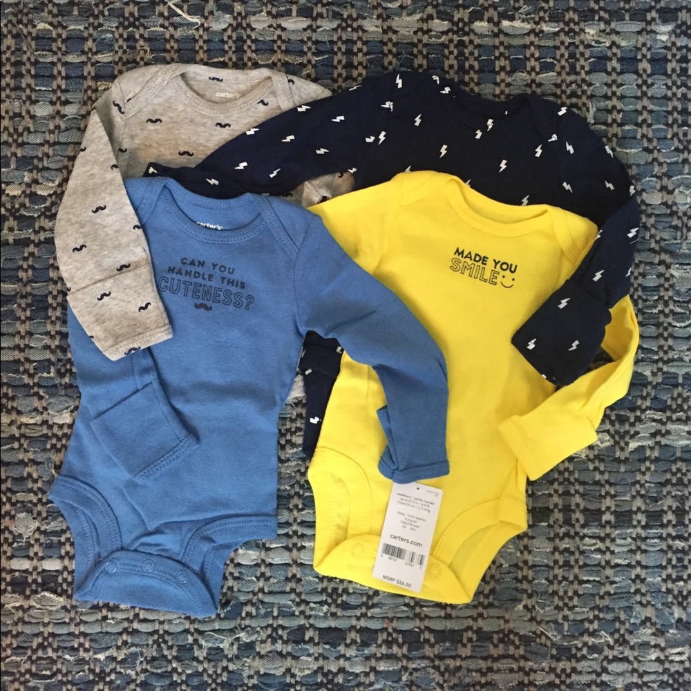 Set of 4 onesies - new with tags- Carters