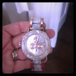 Women's rose gold Nixon left rare left hand watch
