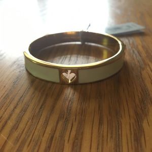 Kate Spade hole punch Spade bracelet in cream