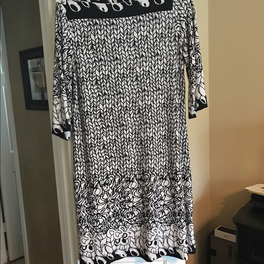 Black and white boat neck sheath dress.