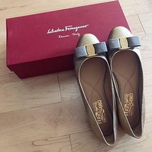 Pair of Gold Salvatore Ferragamo flats with box