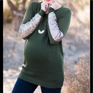 Pinkblush sweater with sequined sleeves.