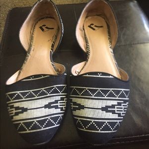 Black and white patterned flats