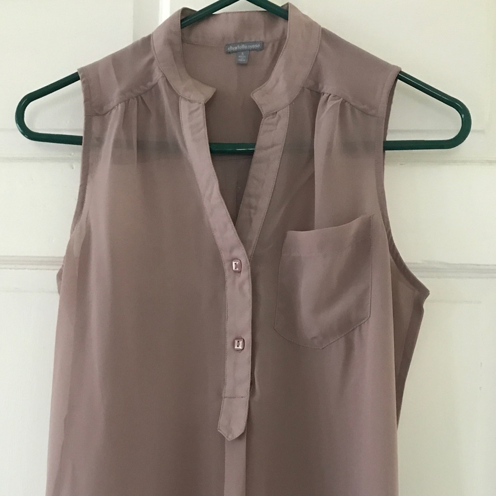 Taupe colored blouse.