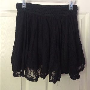 A very cute black lacy skirt.