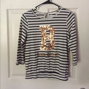 White and black stripped long sleeve shirt.