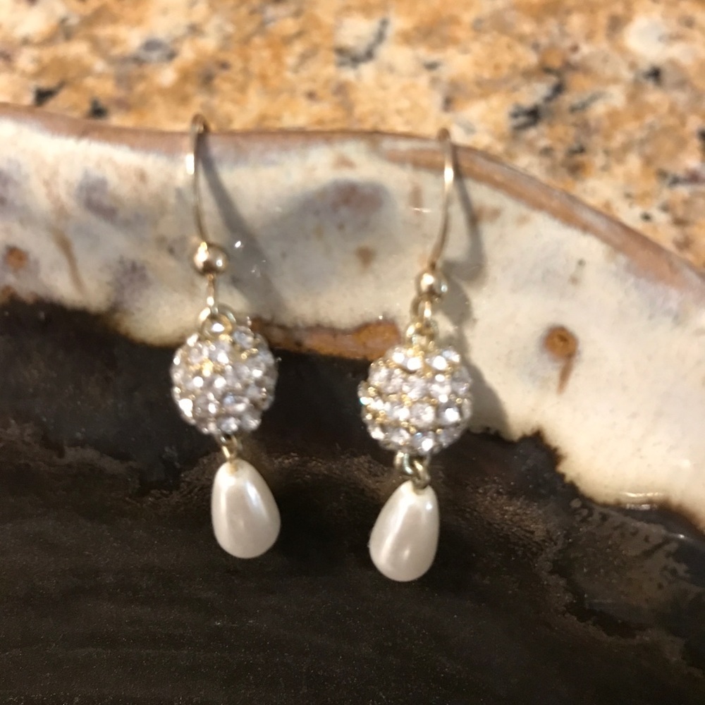 Kim Roger's gold and pearl earrings