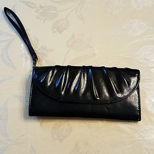 Black wristlet with small black money holder.