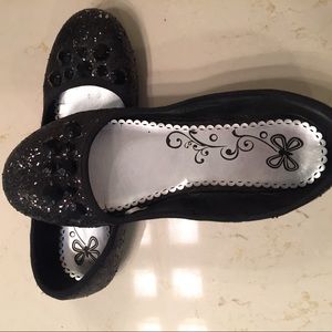 Black sparkly flats with gem stones on the top