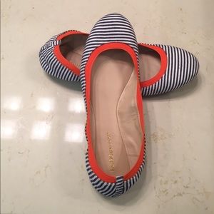 Navy and white flats with orange elastic liner