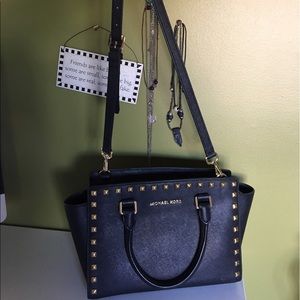 Black, gold studded medium size Michael Kors