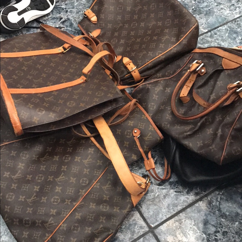 A bundle of five authentic Louis Vuitton purses.