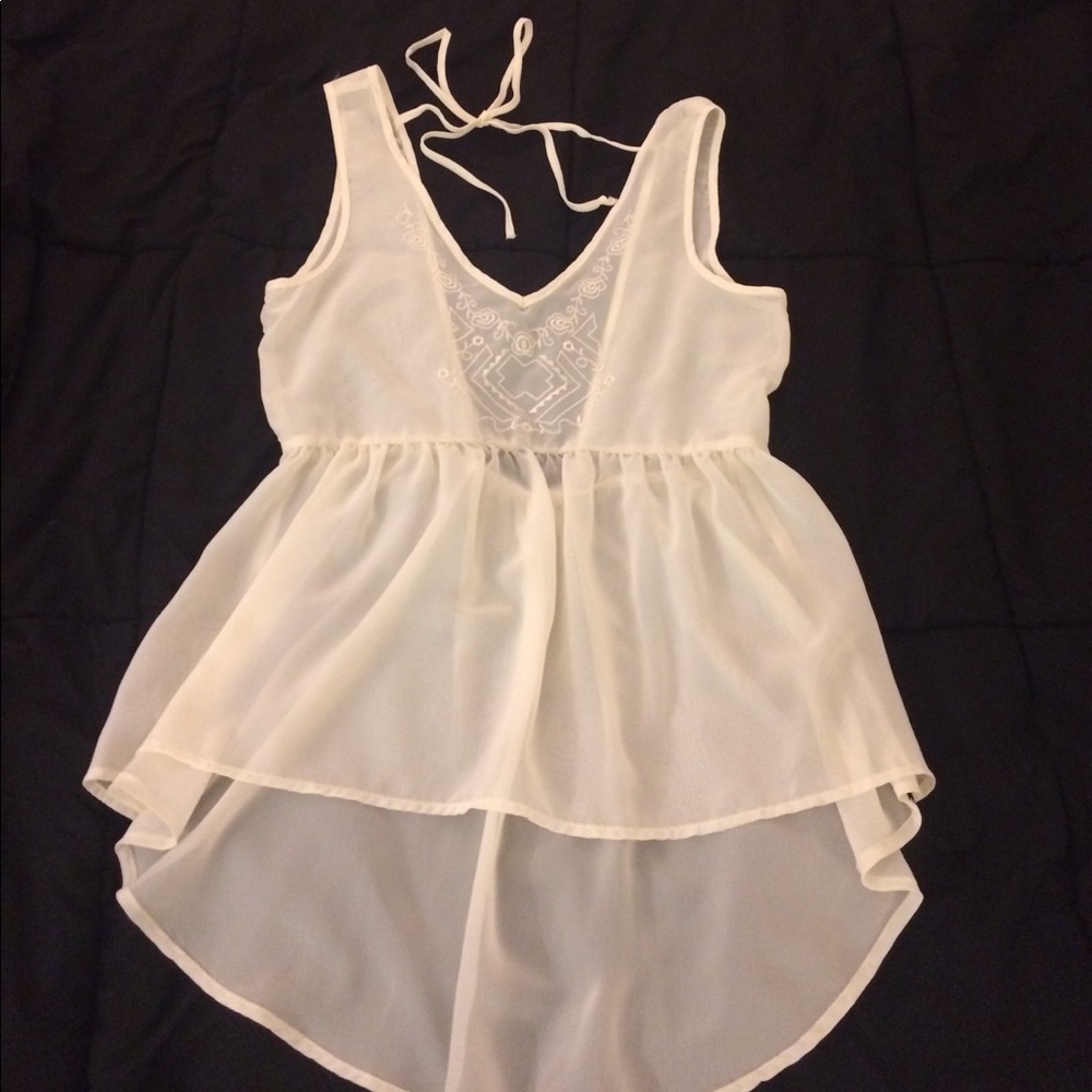 Embroidered cream sleeveless blouse