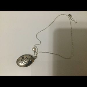 Antique silver plated oval locket with pearl.
