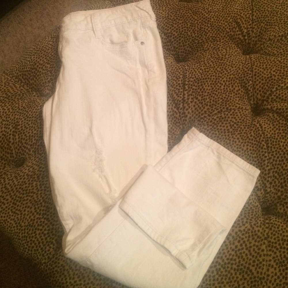 Distressed white skinny jeans.