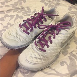 Iridescent white Nike tennis shoes