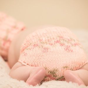 "Pink Rose" hand-knitted baby set.