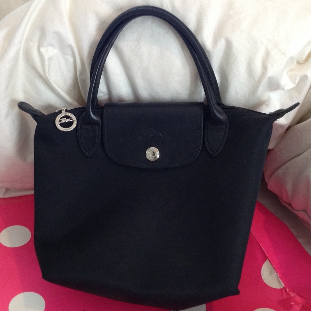 On hold for @tattooeyeliner Longchamp mini tote