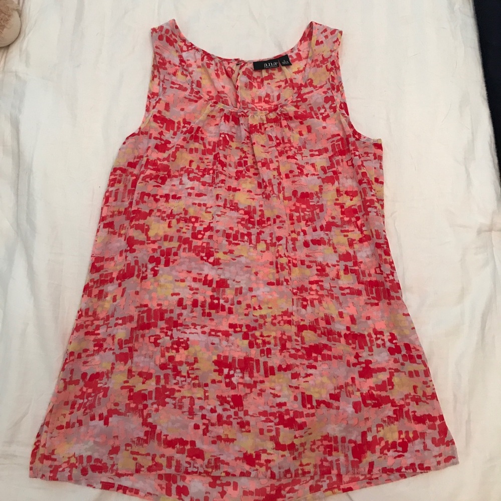 This is an Anna New Approach lose fitting shirt.