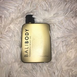 Unused bottle of Bali Body tanning oil