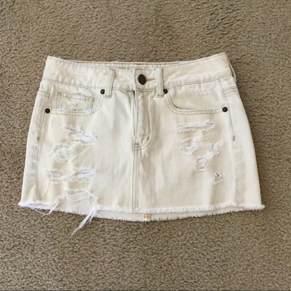 Distressed cream colored jean skirt