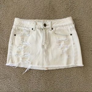 Distressed cream colored jean skirt