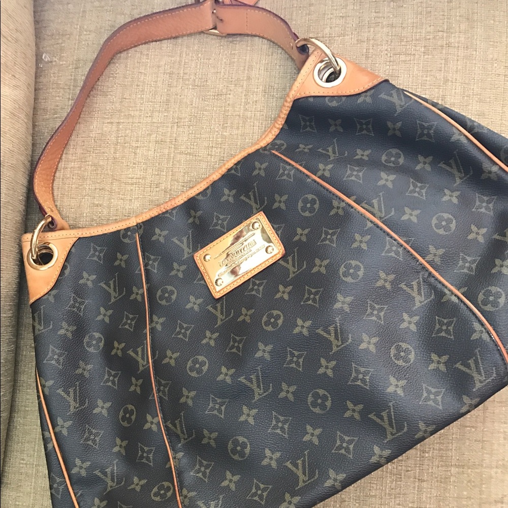 Louis Vuitton Inventeur hobo bag gently used.