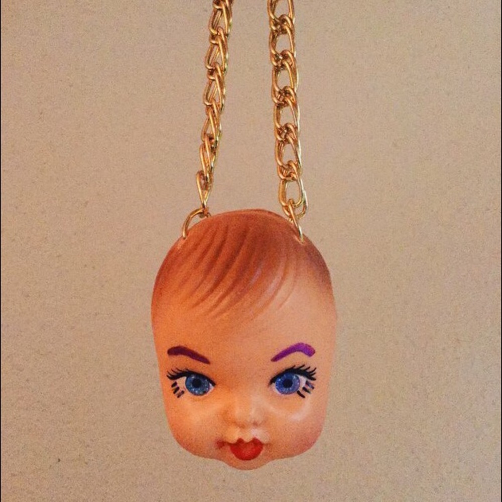 Doll head necklace