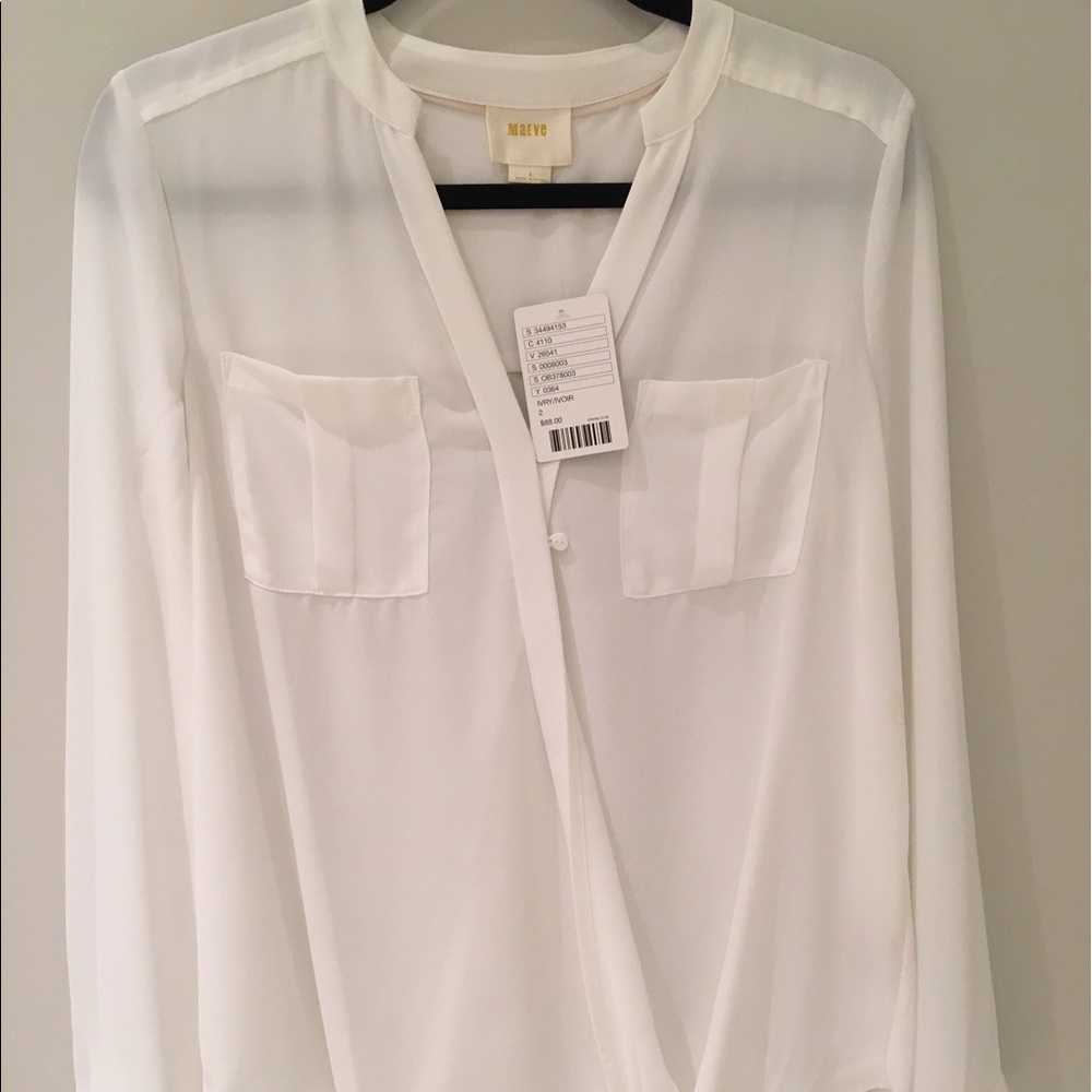 It's a white cross style top and it has a button