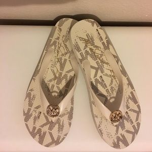 Michael Kors cream and gold flip flops