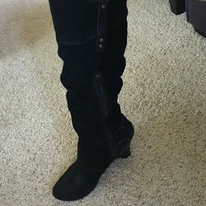 Tall black suede boots