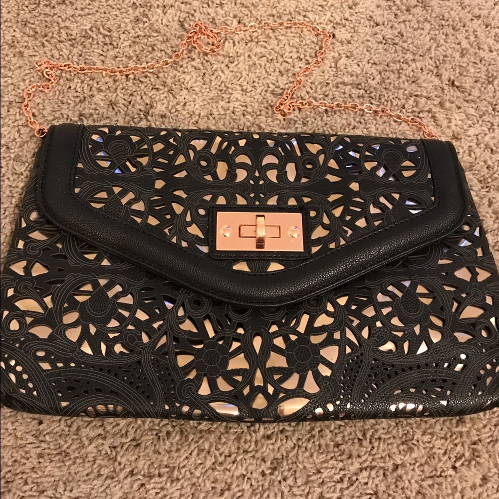 Black and rose gold cut out clutch