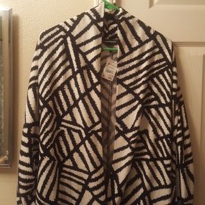 White & black cardigan with buttons at bottom