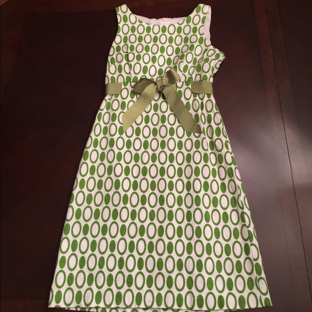 Green and white polka dot dress with bow