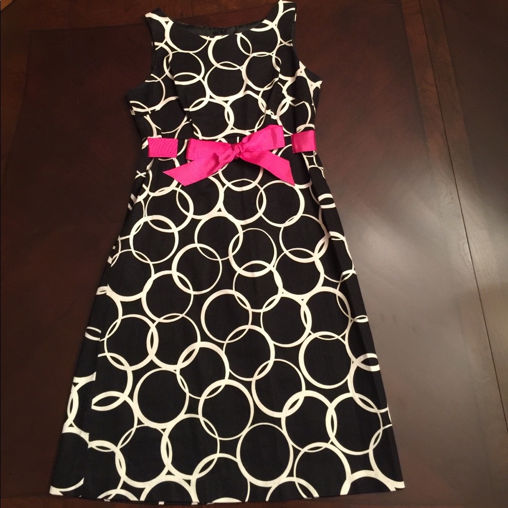 Black and white polka dot dress with pink bow
