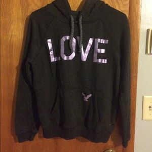 A dark grey and purple American eagle sweatshirt