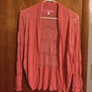 A pink cardigan