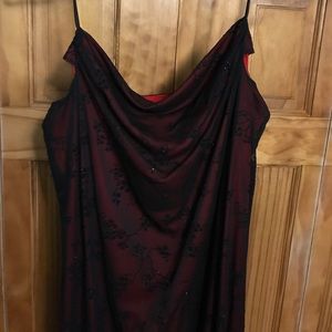 Red w/black sheath that has a floral design on it.